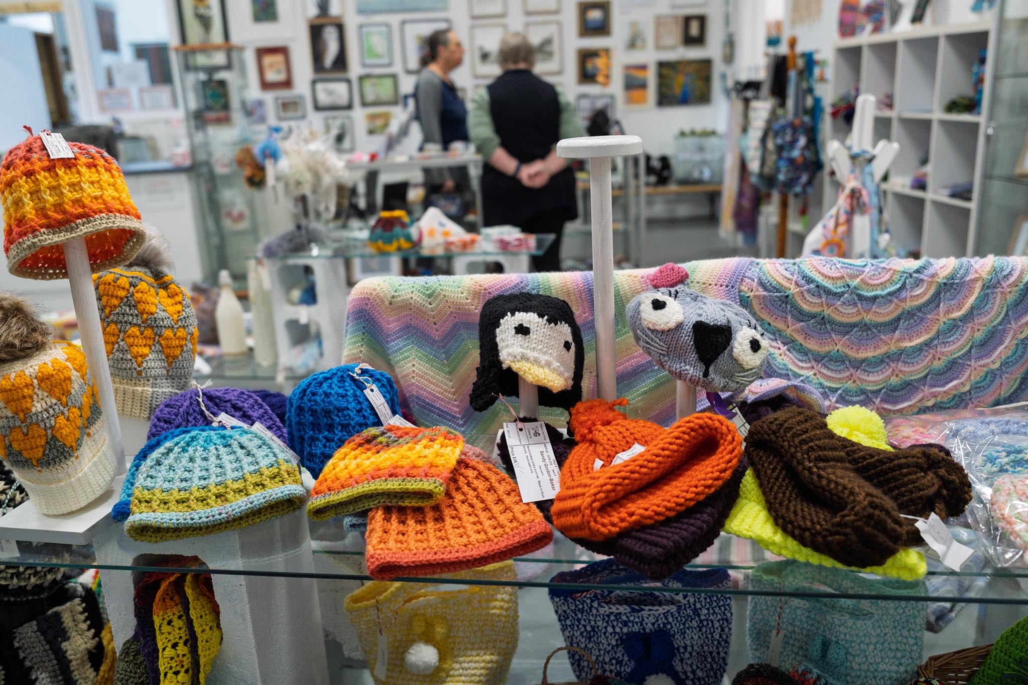 Hand Made Crochet Beanies and caps displayed inside the Tilligerry Arts Group Gallery in Lemon Tree Passage. About TAG