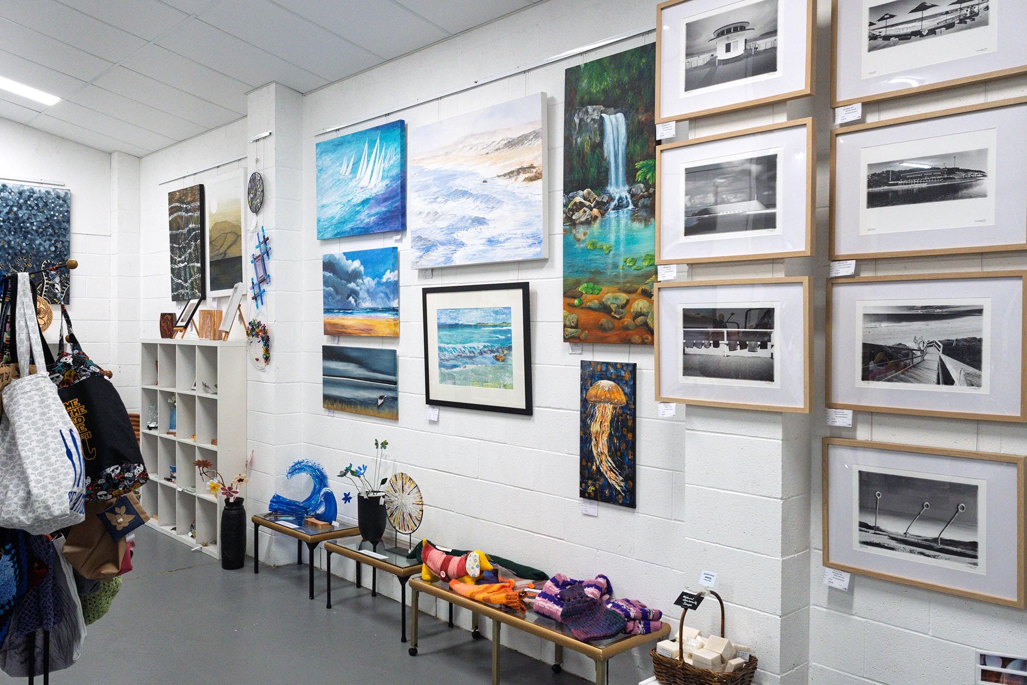 Paintings displayed on gallery walls at the Tilligerry Arts Group Gallery.