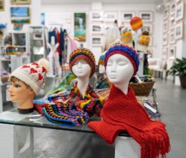 Hand Made Crochet Beanies and scarfs displayed inside the Tilligerry Arts Group Gallery in Lemon Tree Passage.