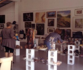 Volunteers setting up craft creations at TAG Gallery. Volunteers setting up artwork and handcrafted items inside the newly renovated TAG Gallery, Lemon Tree Passage.