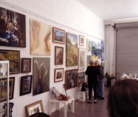 Artwork displayed inside TAG Gallery shortly after the gallery opened. Interior of TAG Gallery displaying paintings and artwork by local artists at Lemon Tree Passage.